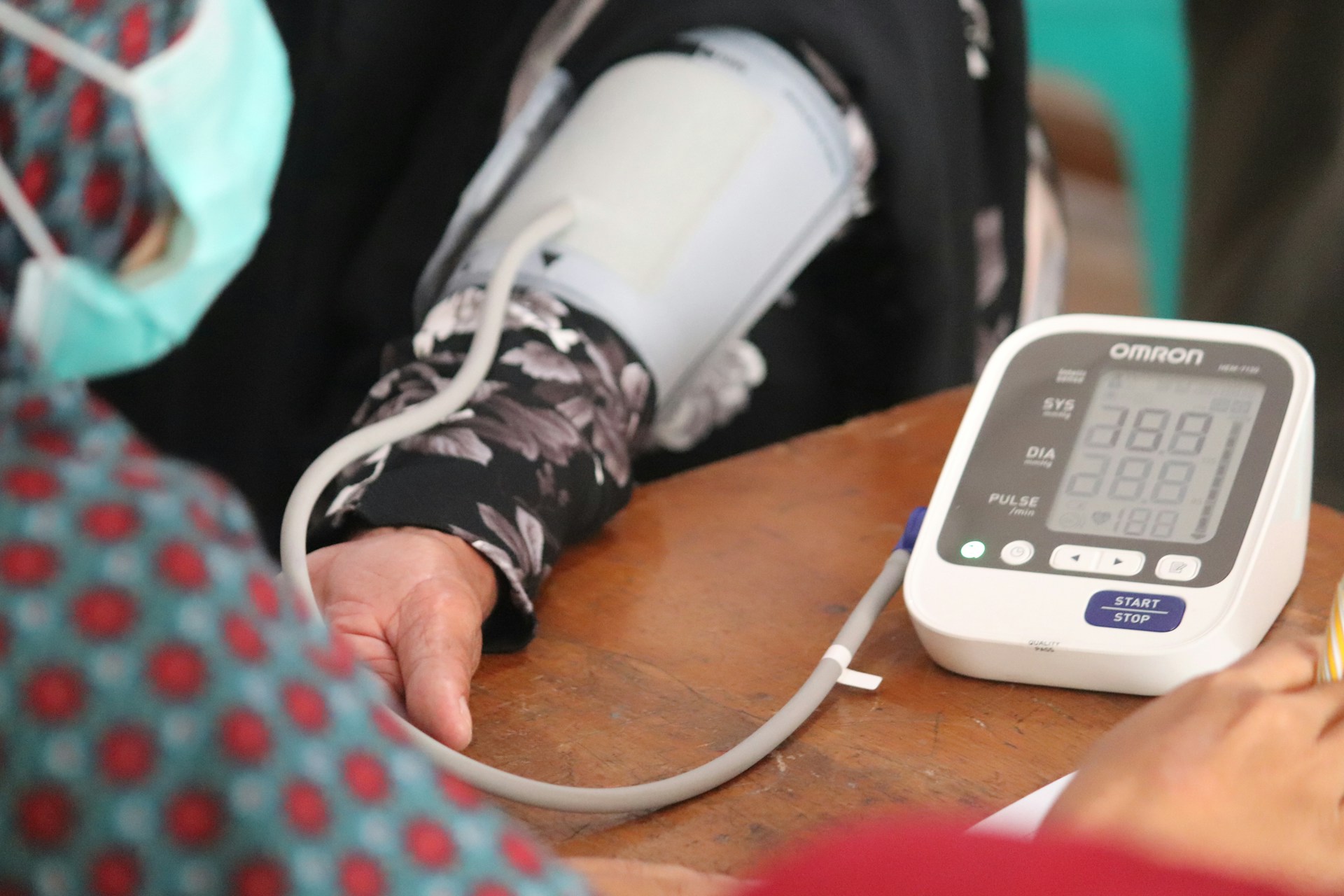 Blood pressure test on man's arm