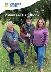Three volunteers standing together in the Castlemaine Botanic Gardens