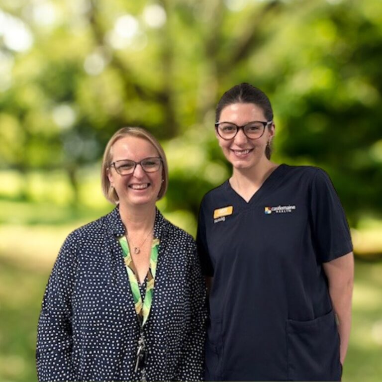 photo of Jenny and Lizzie from the At Home program, in front of a garden background.